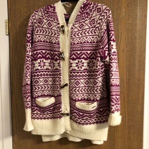 A purple and white sweater with a hood.